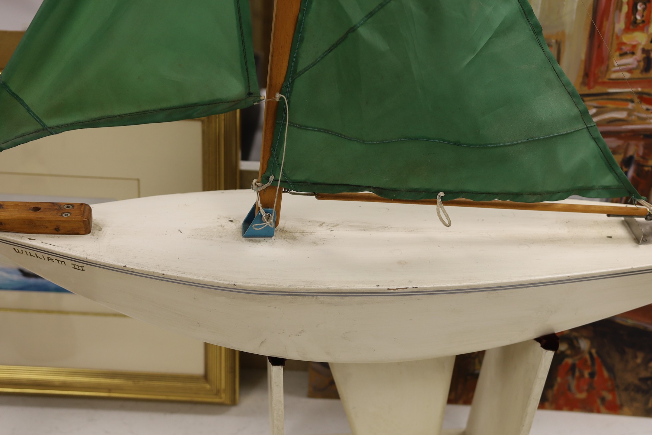 A pond yacht with stand, 100cms wide x 100cms high.